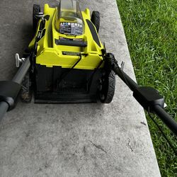 Ryobi 40V battery powered lawn mower and 18V battery weed eater