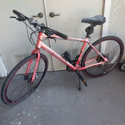 Red Schwinn Kempo Hybrid bike