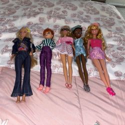 5 Barbie dolls