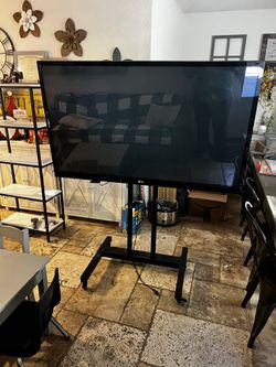 54 Inch LG With Rolling Stand Good Condition Both