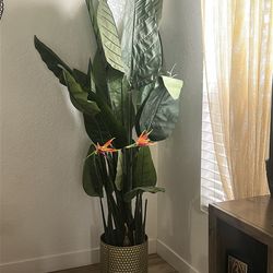Faux plant with planter