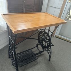 Vintage table repurposing an antique treadle sewing machine base, home decor or a unique side table