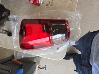 Right Side Of Tacoma Headlight. Stock.