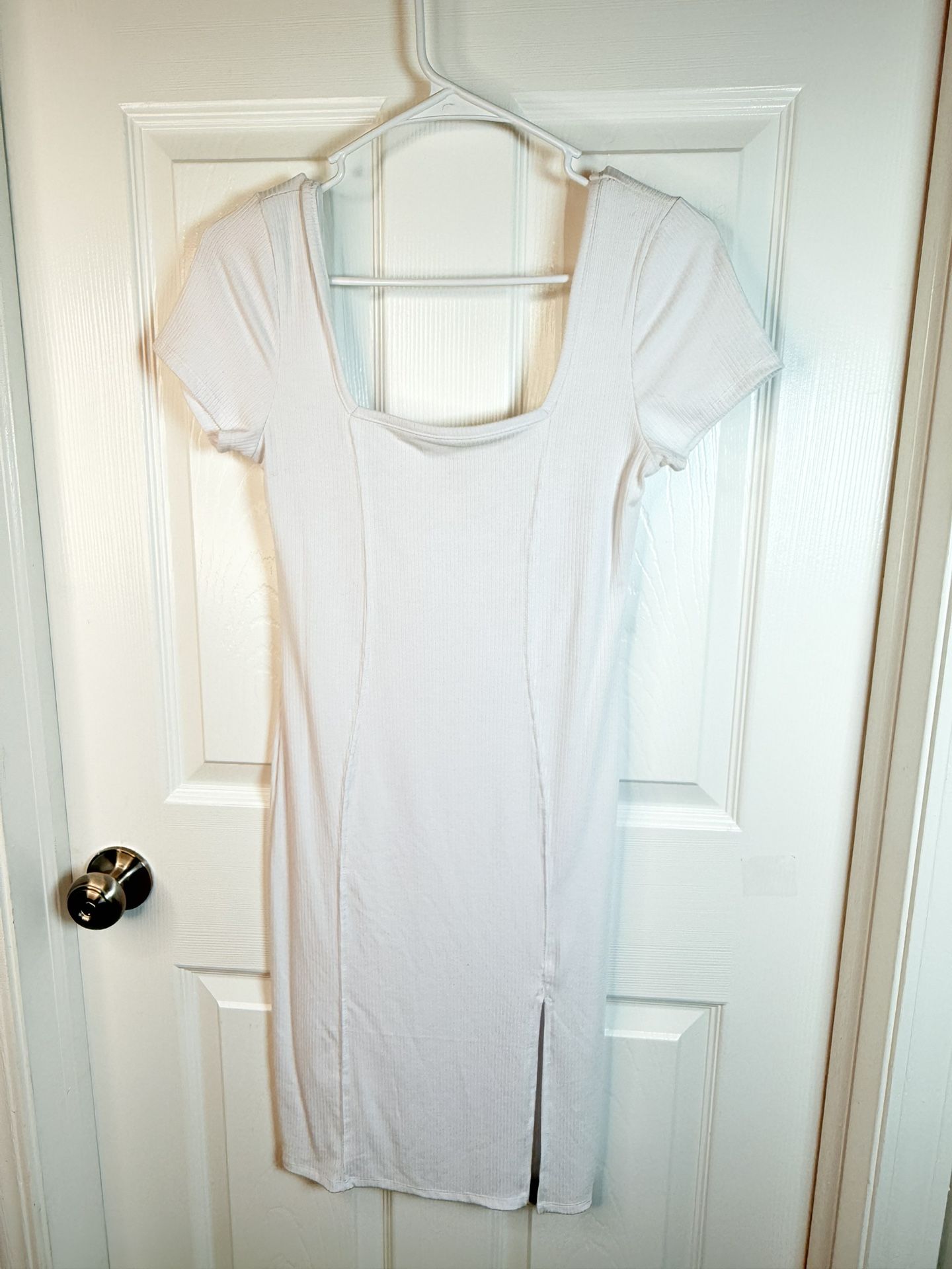 White dress 47% polyester 46% Rayon 7% Elastic