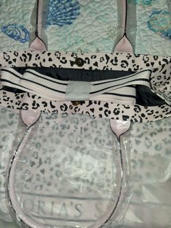 Brand new Victoria secret pink and black tote with pockets strap. Washable
