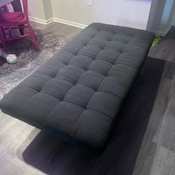 Black Tufted Ottoman with Wooden Legs 