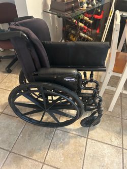 Wheelchair- 16” Seat Width Invacare 9000 SL Wheelchair with Padded Backrest + Elevated Footrests