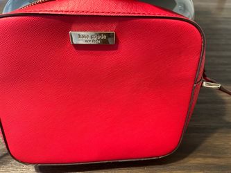 Purse color is red. Authentic Kate Spade