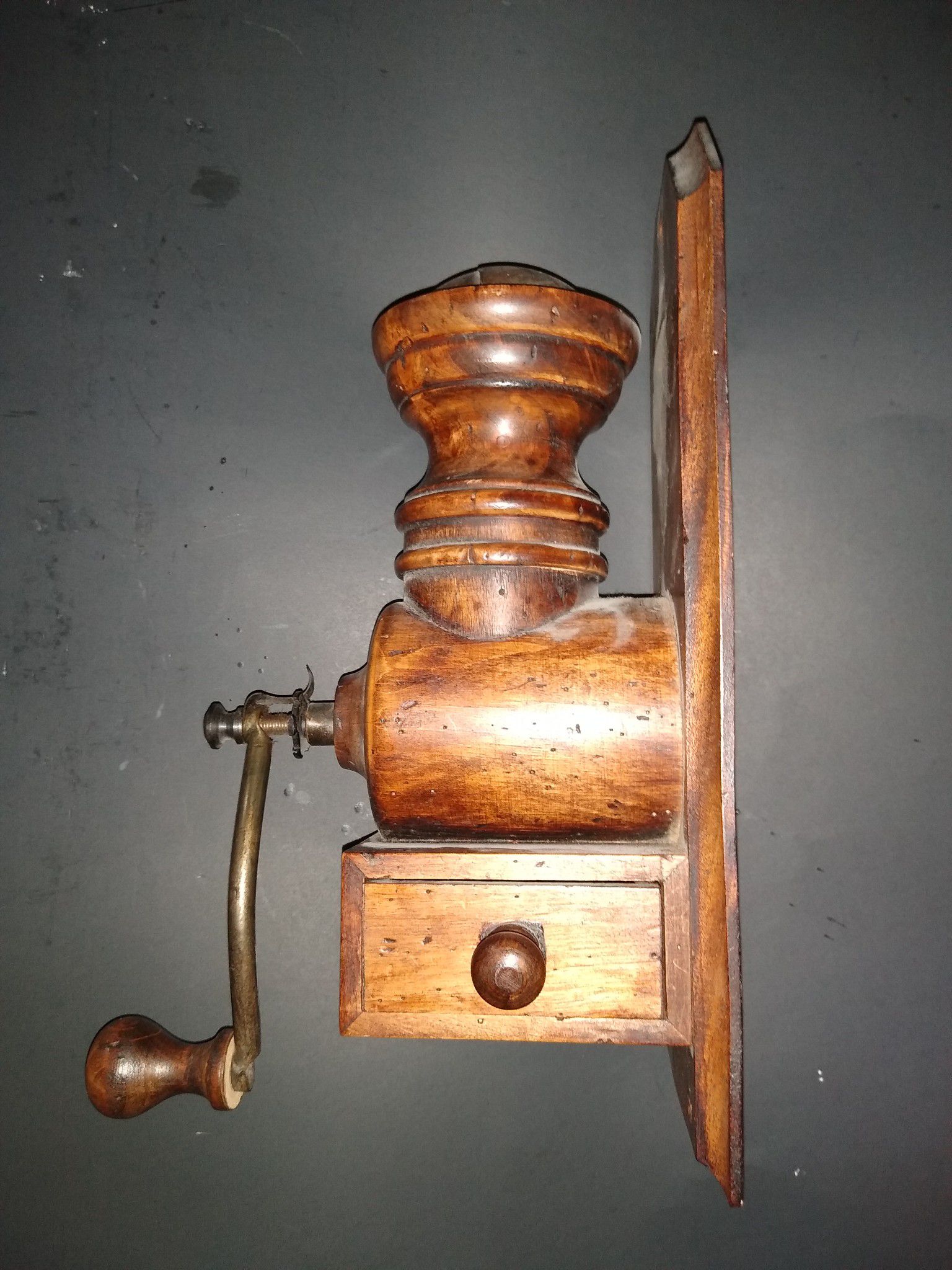 Antique wall mount coffee grinder all wood with the exception of handle , shaft and gears.