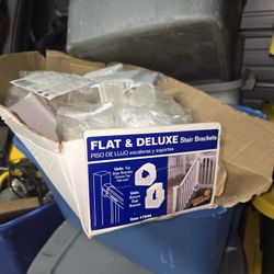 Box of Severe Weather plastic universal stair rail brackets and balcony rail brackets.