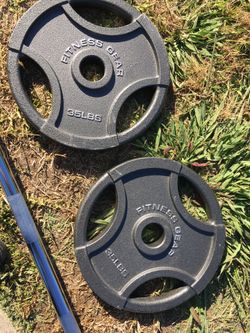 Two 35lb plates brand new and Olympic bar new