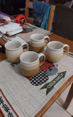 Speckled yellow tan coffee cups