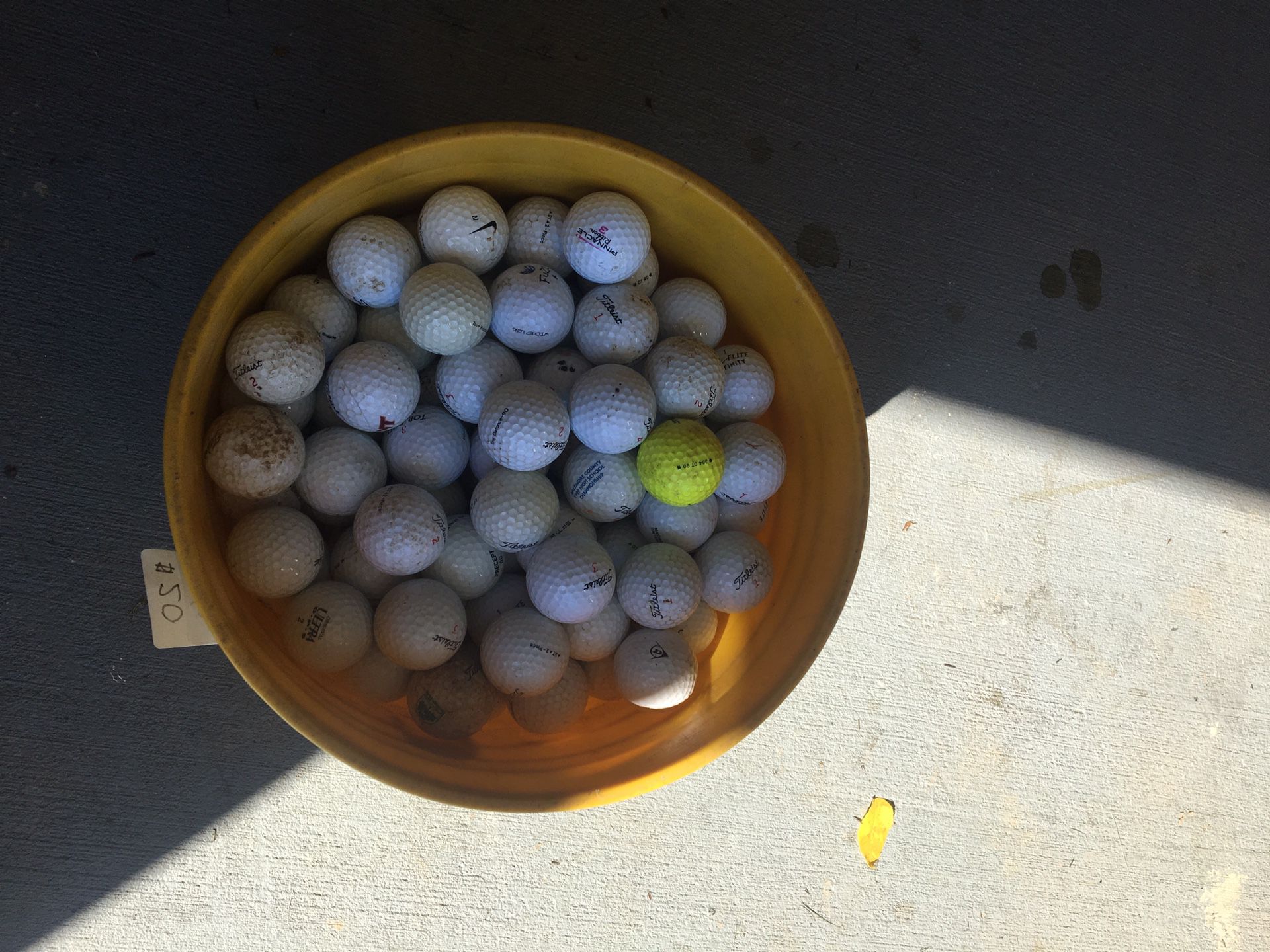 Bucket of used golf balls