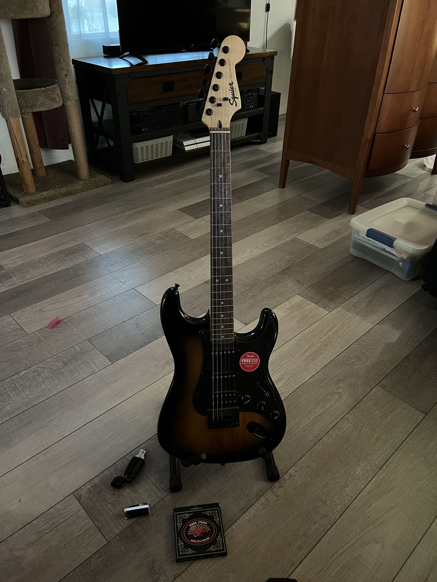 Guitar + Stand + Digital Tuner + Strings + String Winder/Cutter