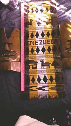 A Venezuela Wall Hanger And Two Tiki Mask's