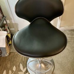 Modern black bar stool with chrome base 