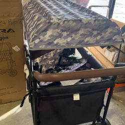 Trolley，foldable all-terrain stroller with sun canopy, adjustable handle, convertible high seat, and storage bag, black + purple $150