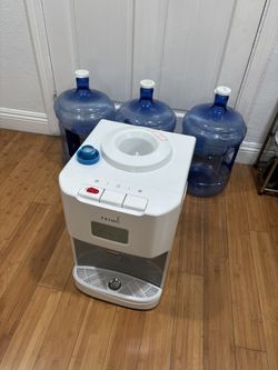 primo water filter w/ three water jugs