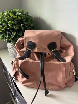 Steve Madden Pink Nylon Backpack Purse With Dark Gray Leather Buckles.
