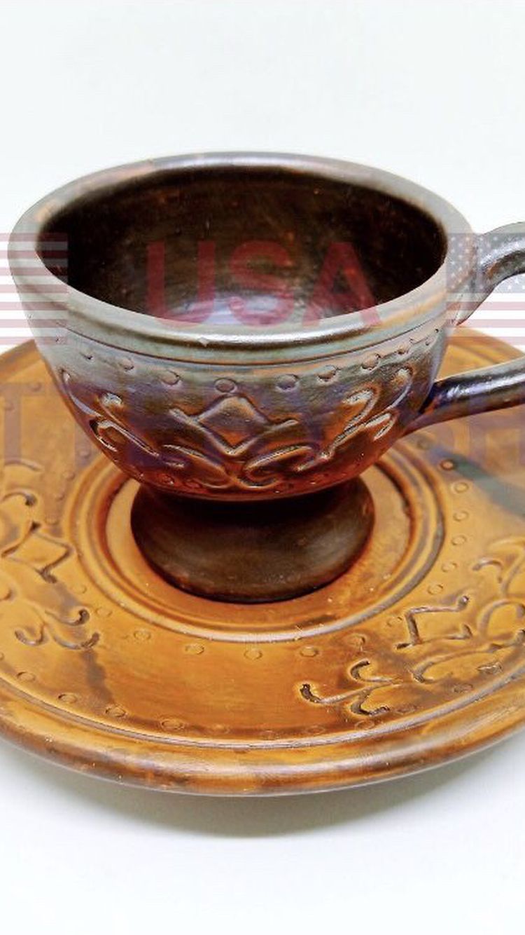 Handmade Pottery tea/coffee cup and saucer.