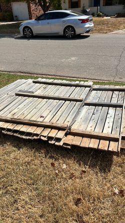 29’ wooden fence 6’ with one 4’ gate with gate hardware