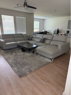 Sectional sofa with carpet and coffee table