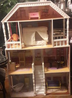 Wooden doll house almost 4ft accessories included