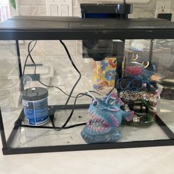 3 Gallon Fish Tank With Accessories: Pebbles, Water Filter, Net, Two Decorative Statues, and Fish Food