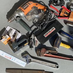 Lot of tools, half-inch drill pipe wrench, crescent  wrench, garden shears, and more!