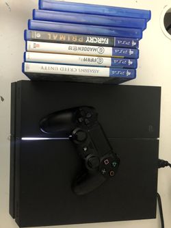 PlayStation 4 with games and 2 controllers