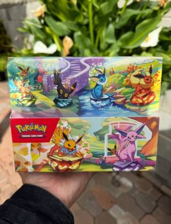 Prismatic Evolutions Display Tins