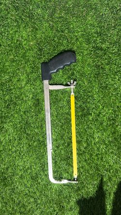 hand hacksaw with a replaceable metal-cutting blade.