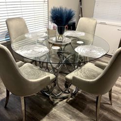 Dining Room Set. Glass Table w/ Stainless Steel Base and 4 Gray Velvet Chairs w/ Stainless Steel legs 