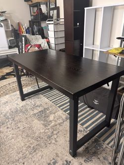 Wooden Table With Metal Supports 