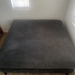 blue square ottoman with black legs 