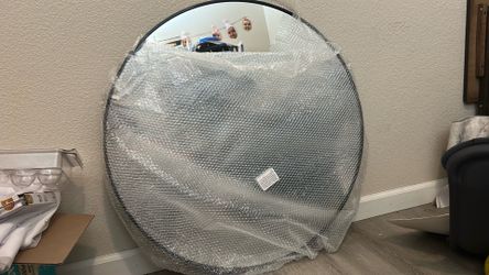 Black rim round wall mirror