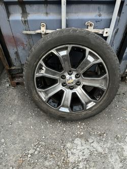 set of 22” stock Chevy wheels & Bridgestone tires $