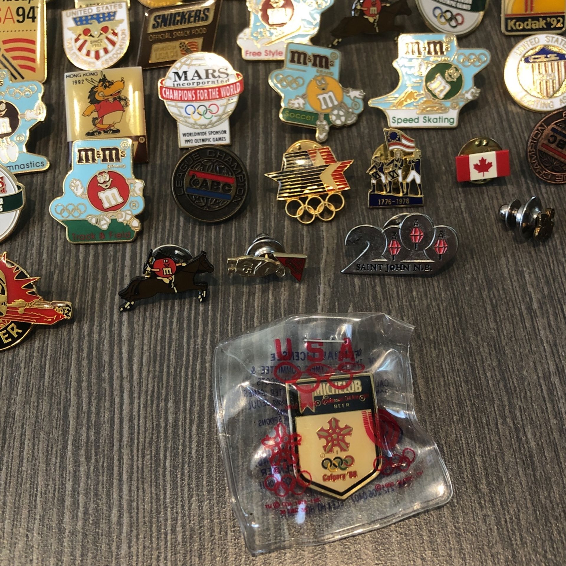 45 sponsored olympic metal collectors pins. Various sporting events of different years