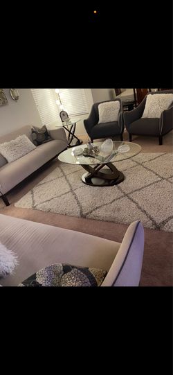Two couches with two chairs.