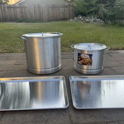A set of large pots and trays.