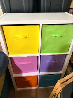 White open shelf with cube baskets
