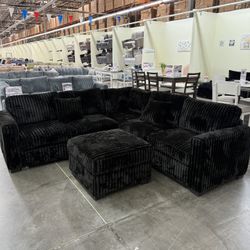 BRAND NEW BLACK FLUFFY CORDUROY SECTIONAL WI OTTOMAN