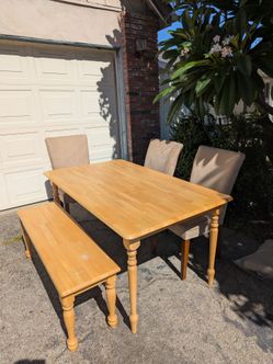 Table, 4 chairs, and bench