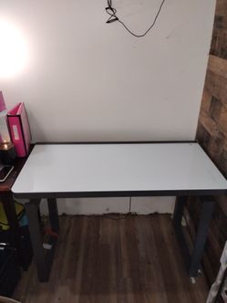 Height-Adjustable Standing Desk featuring a sleek tempered glass desktop and integrated perimeter RGB LED lighting.
