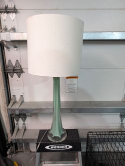 Pretty table lamp, glass pale aqua colored base, white shade. 30in tall and shade 12in diameter good condition