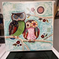 This is a work by artist Lori Siebert, commonly known as "Two Owls." 