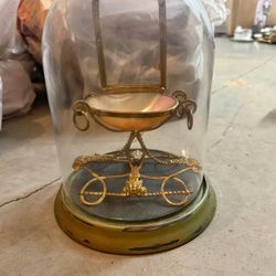 antique Victorian glass dome containing a miniature decorative chair W/mother of pearl