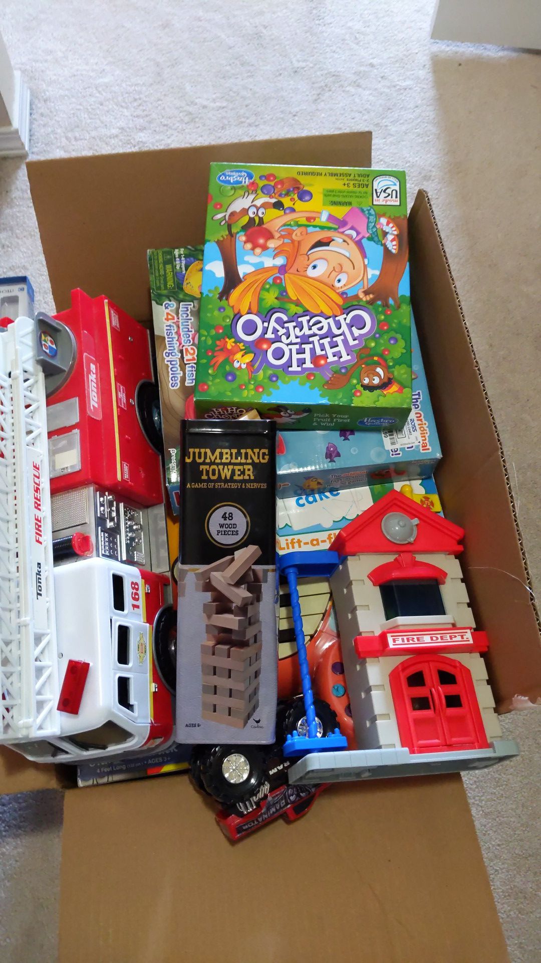 Box of toys, puzzles, piano, games