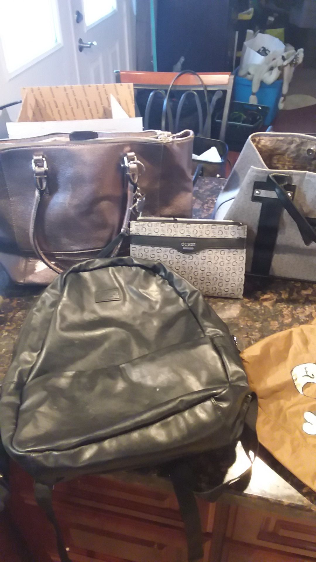 Lot of womens handbags and backpacks