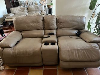 recliner couch with cup holder and compartment.
